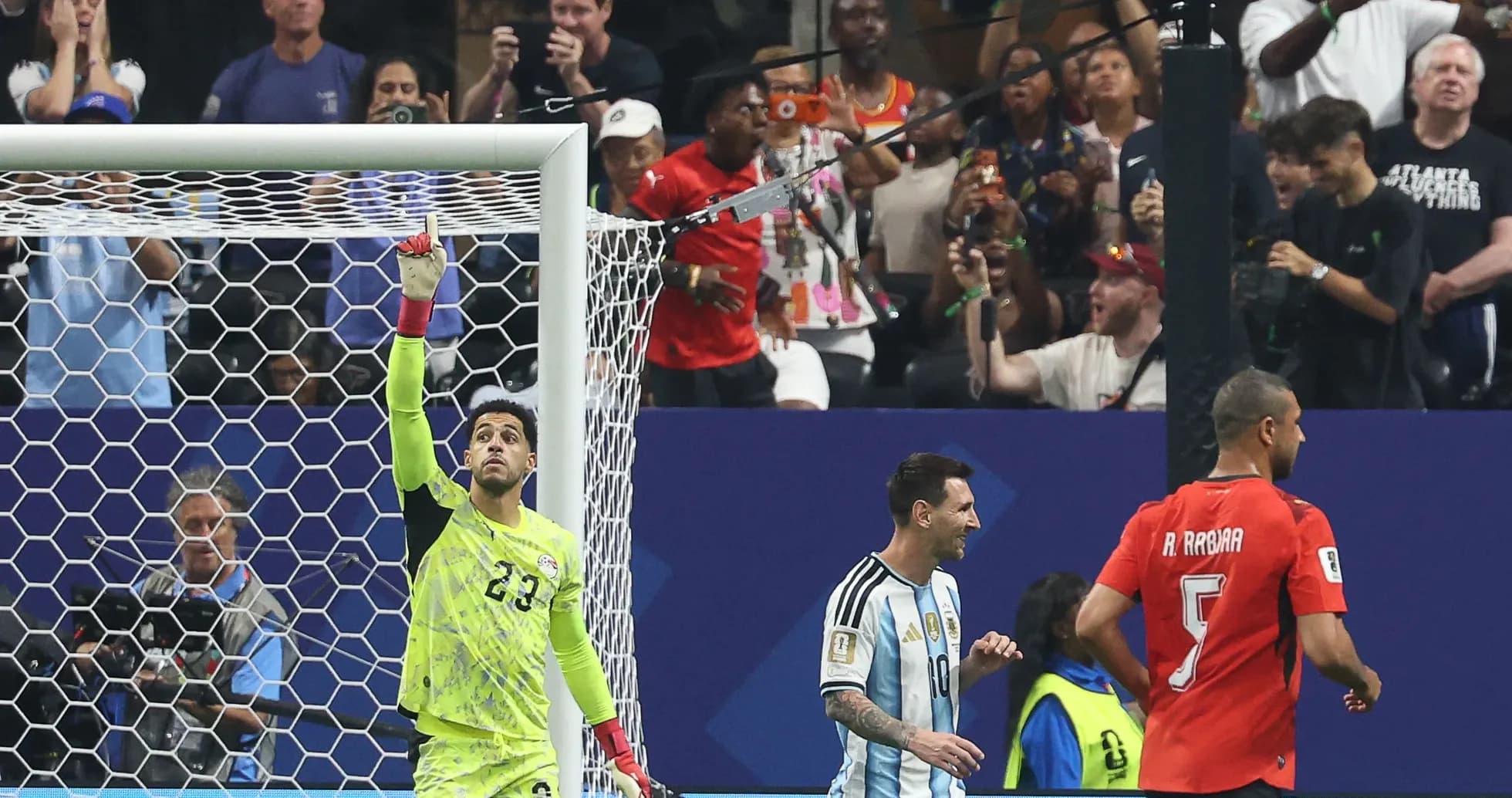 Goalkeeper celebrating with teammates during match