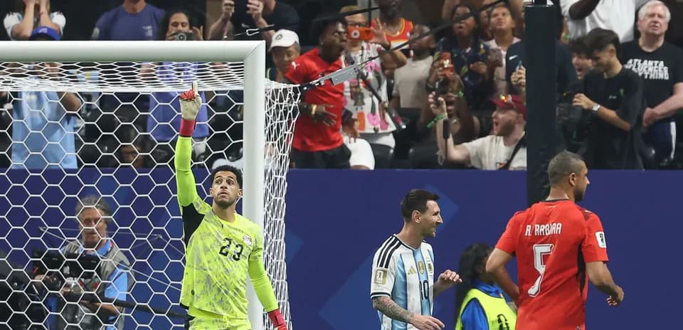 Goalkeeper celebrating with teammates during match
