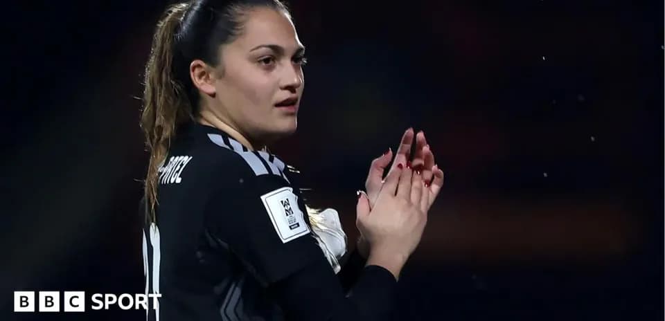Goalkeeper applauding fans during a match