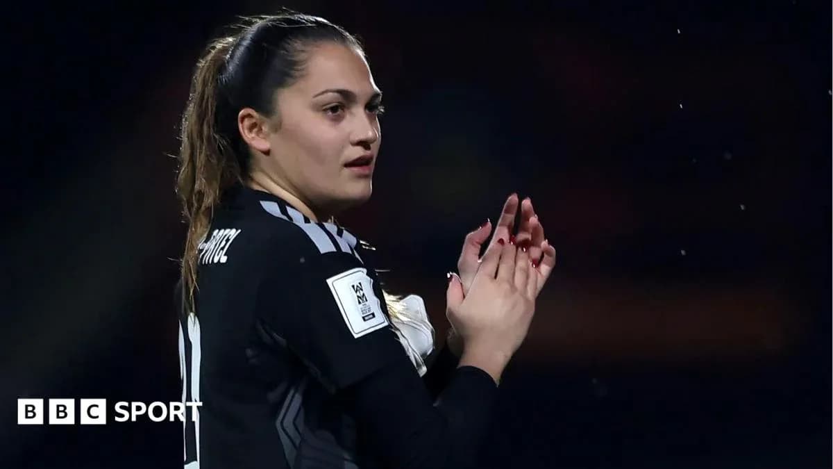 Goalkeeper applauding fans during a match