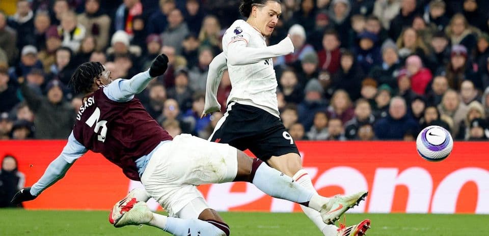 Player tackling during Aston Villa vs Liverpool match