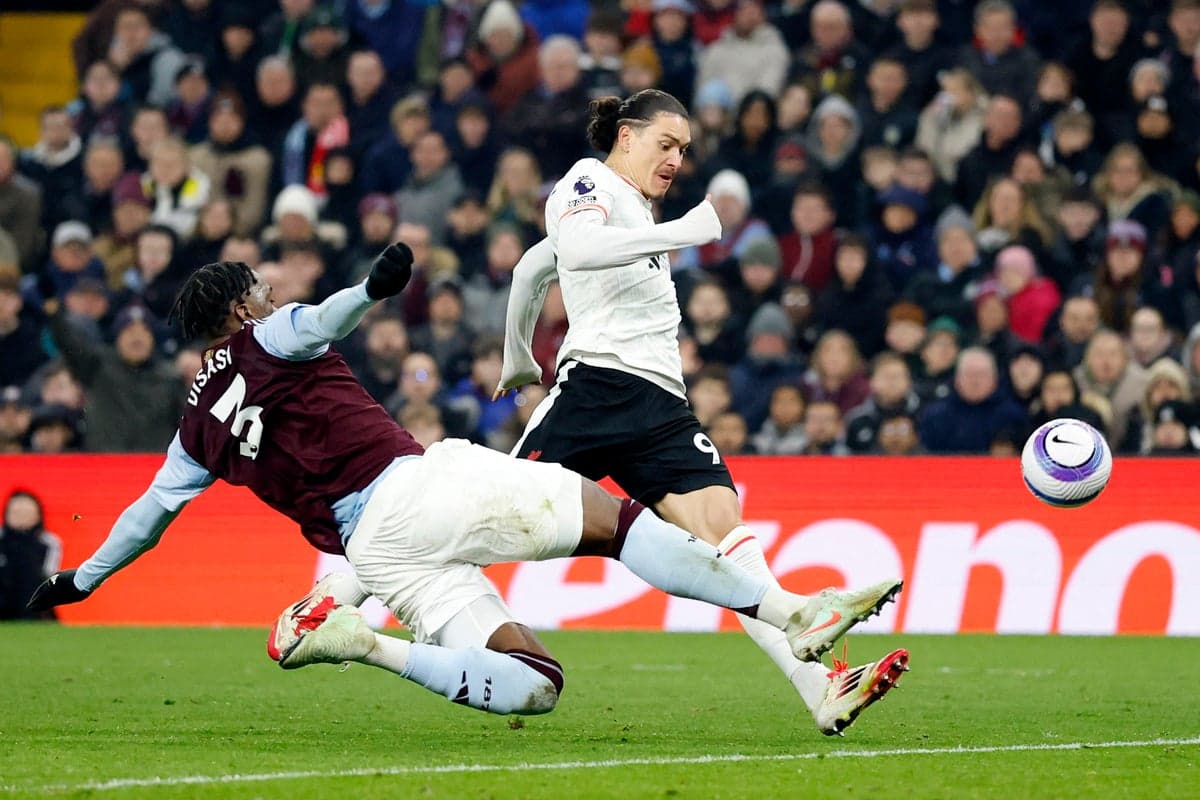 Player tackling during Aston Villa vs Liverpool match