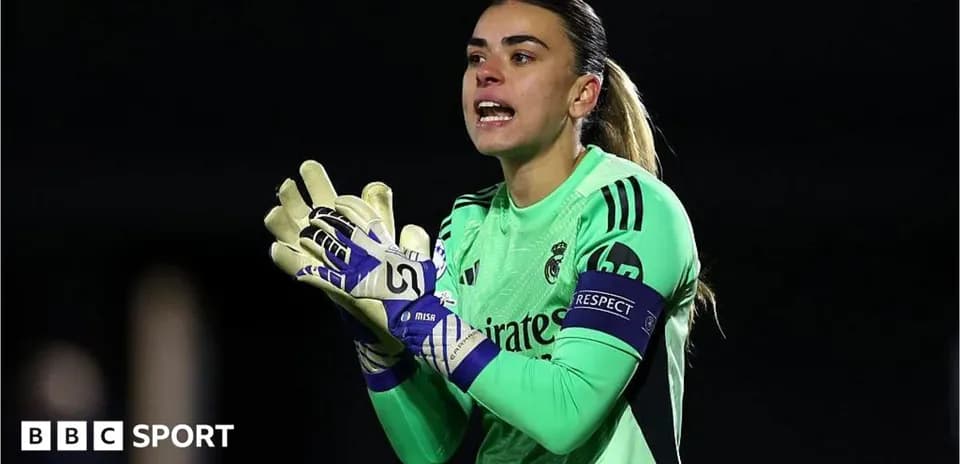 Goalkeeper wearing green jersey and gloves giving instructions