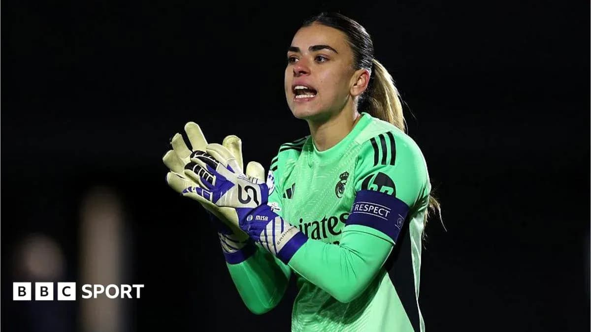 Goalkeeper wearing green jersey and gloves giving instructions