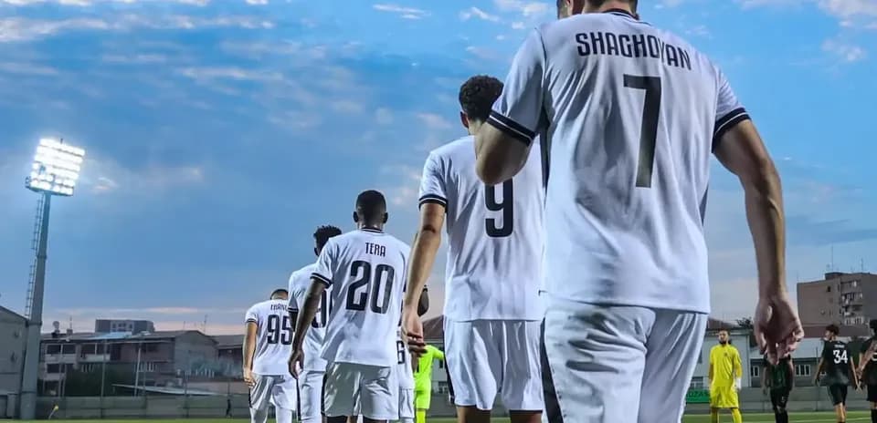 Players walking onto the pitch for UEFA match