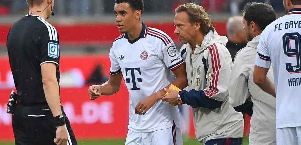 Bayern Munich player receiving treatment from staff