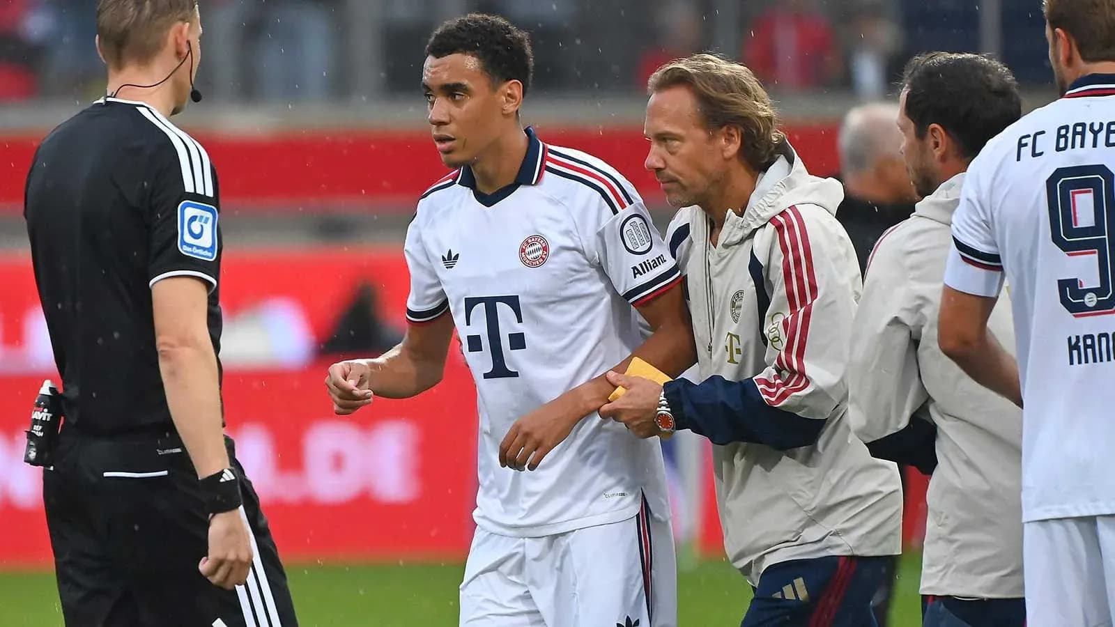 Bayern Munich player receiving treatment from staff