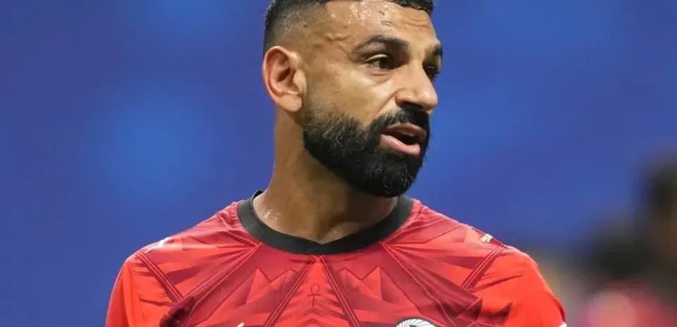 Player wearing red jersey during football match