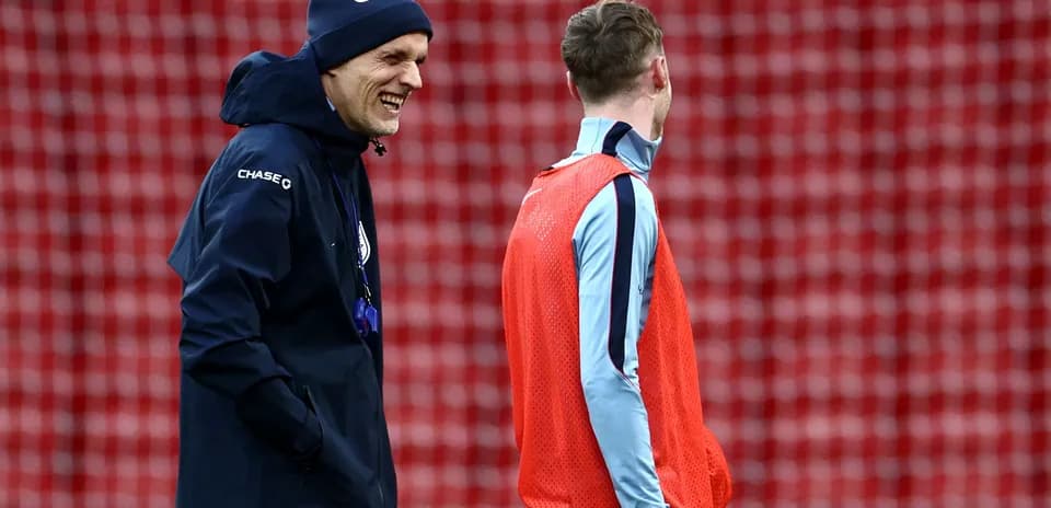 Coach and player talking during training session