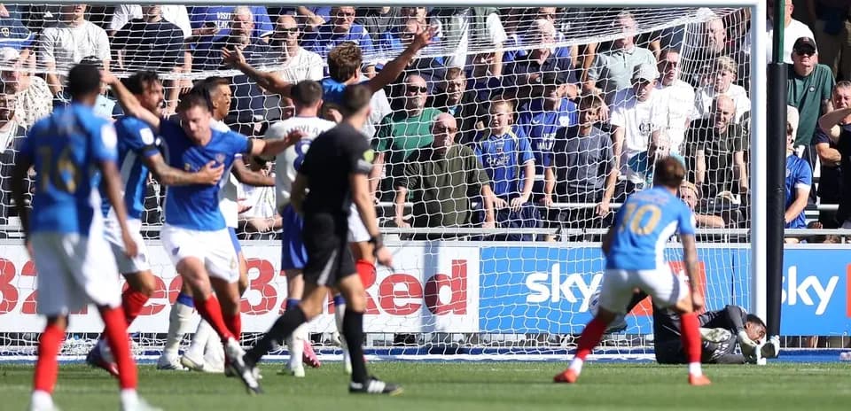 Players reacting after a goal attempt in match