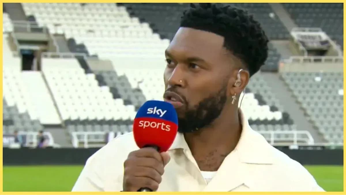 Presenter speaking into microphone at stadium