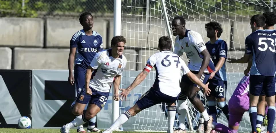Players celebrating a goal during match
