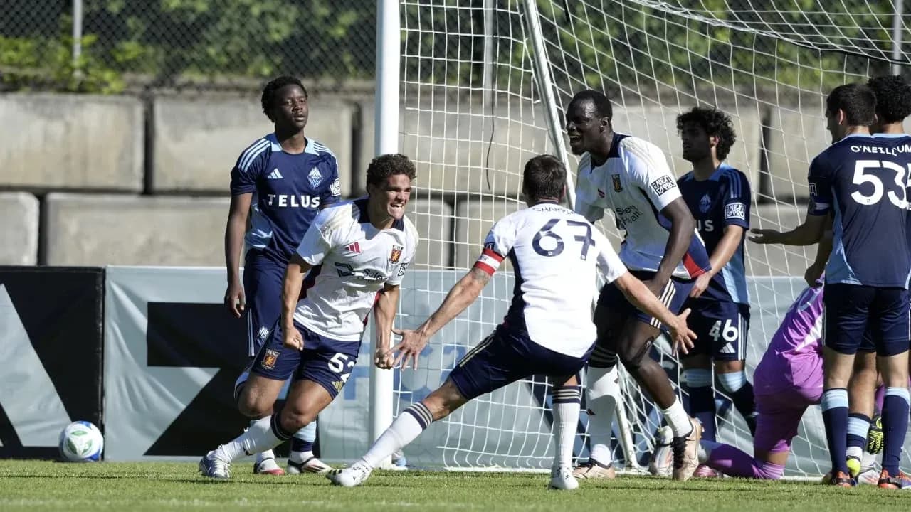 Players celebrating a goal during match