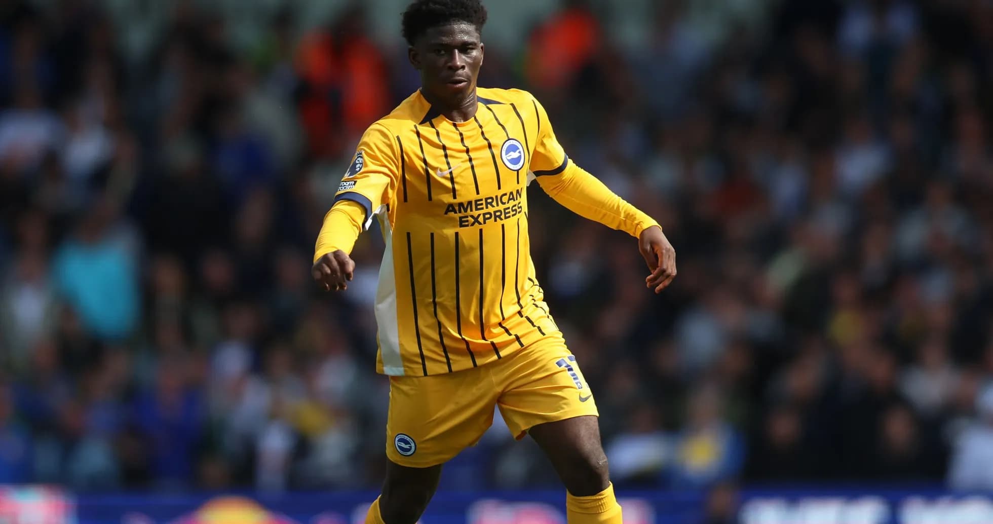 Player in yellow jersey running on the field