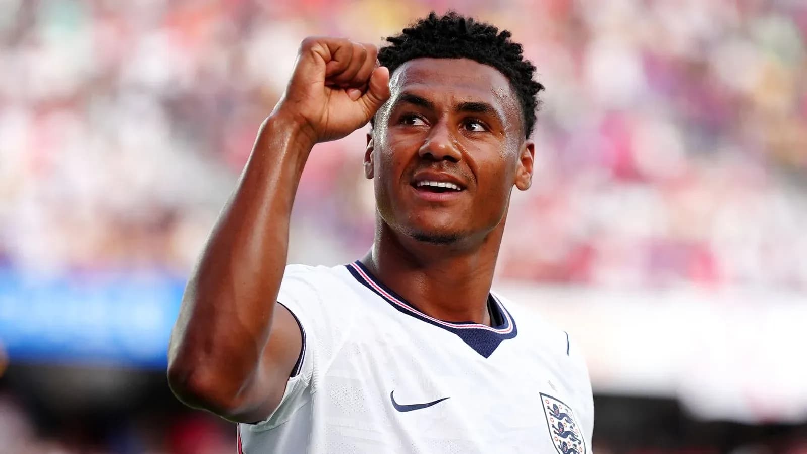 Player celebrating with raised fist in football match