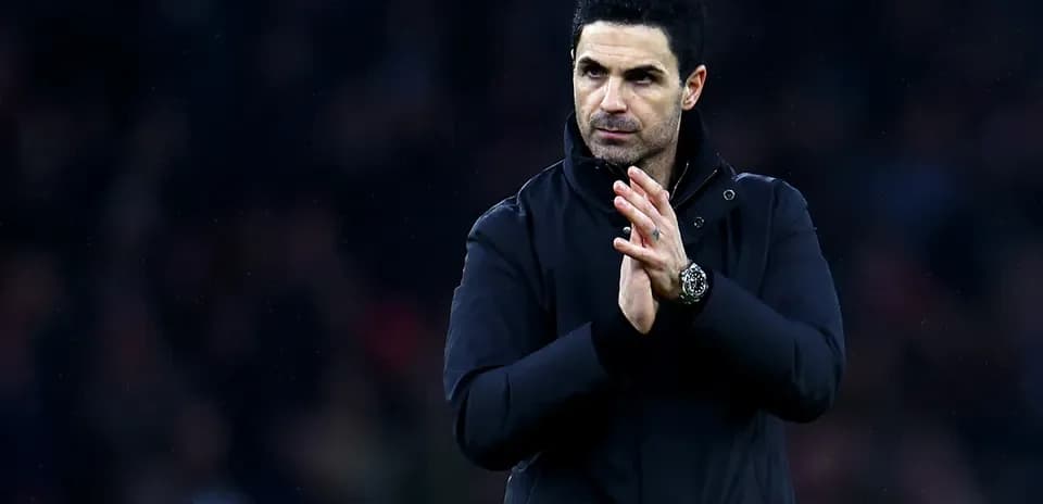 Manager applauding fans after match