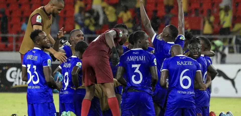 Players celebrating victory in football match