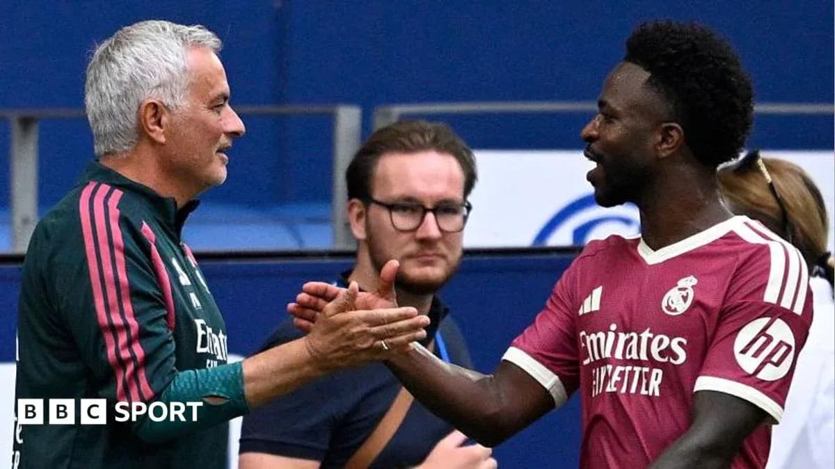 Manager and player shaking hands during match