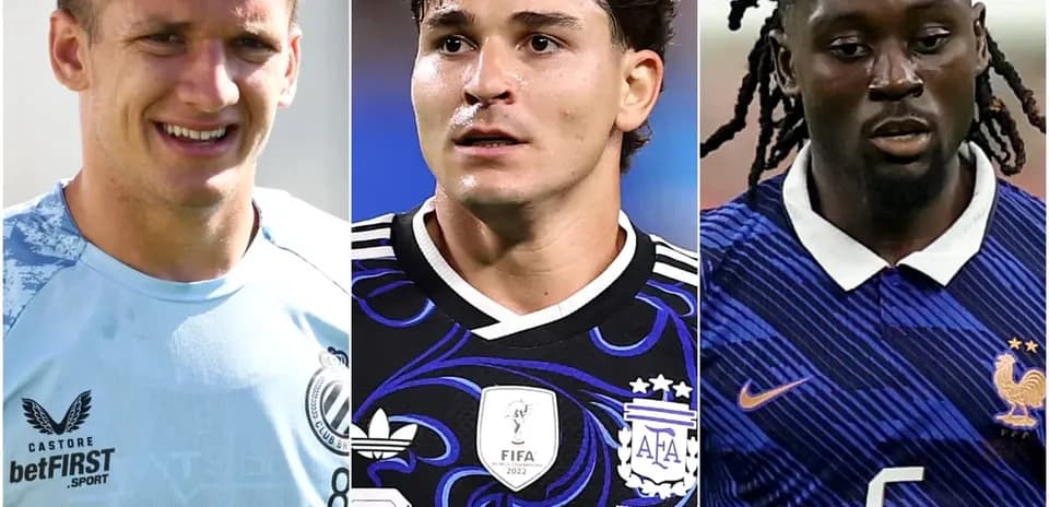 Three soccer players in their team jerseys