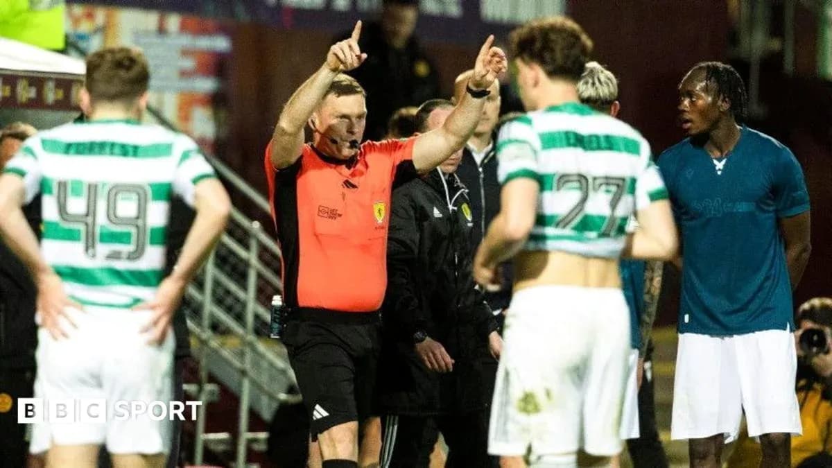 Referee giving instructions to players during match