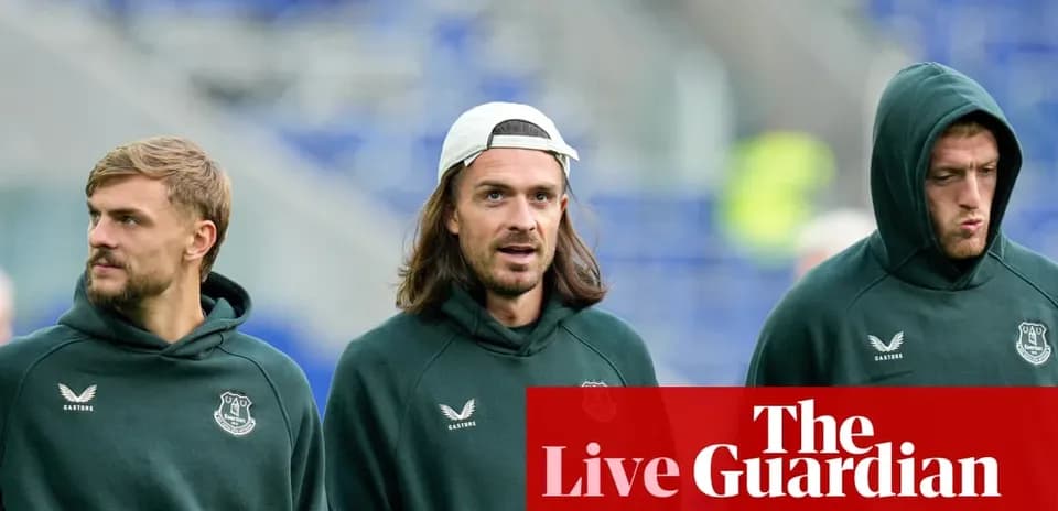 Three players in Everton hoodies walking together