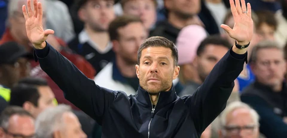 Coach gesturing during a football match