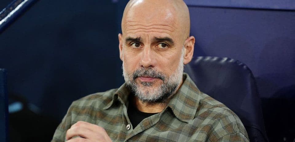 Coach seated on bench during match observation