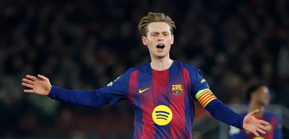 Player gesturing during match, wearing Barcelona jersey