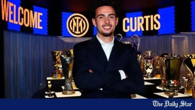 New player posing with trophies at club welcome event
