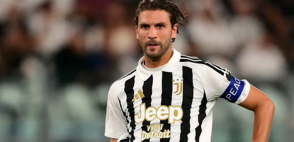 Juventus player in black and white striped jersey