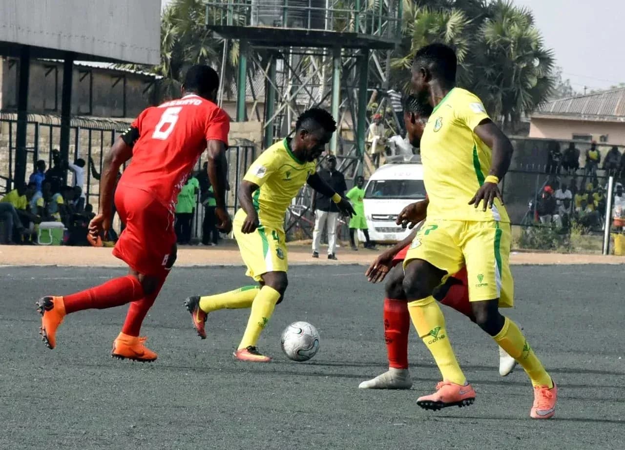 Players competing for the ball during match