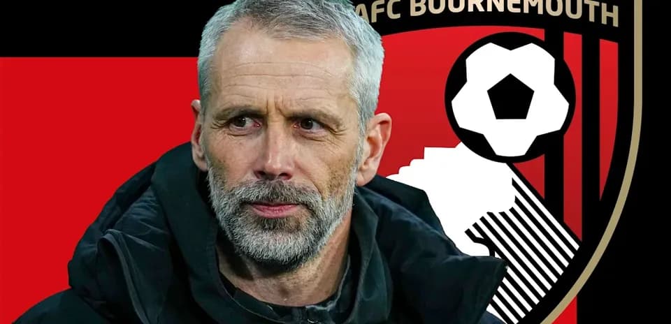 Coach in front of AFC Bournemouth logo background