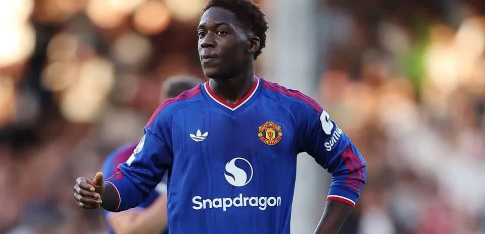Player in blue Manchester United kit during match