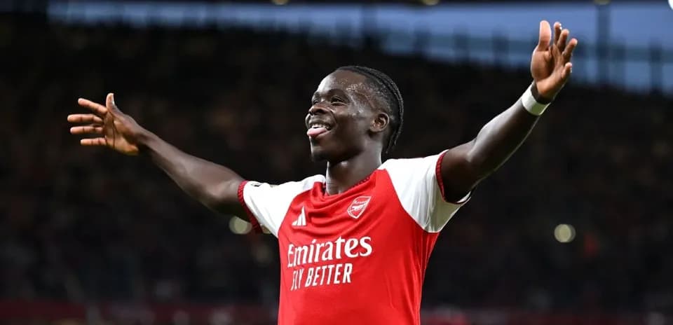 Player celebrating a goal for Arsenal at stadium