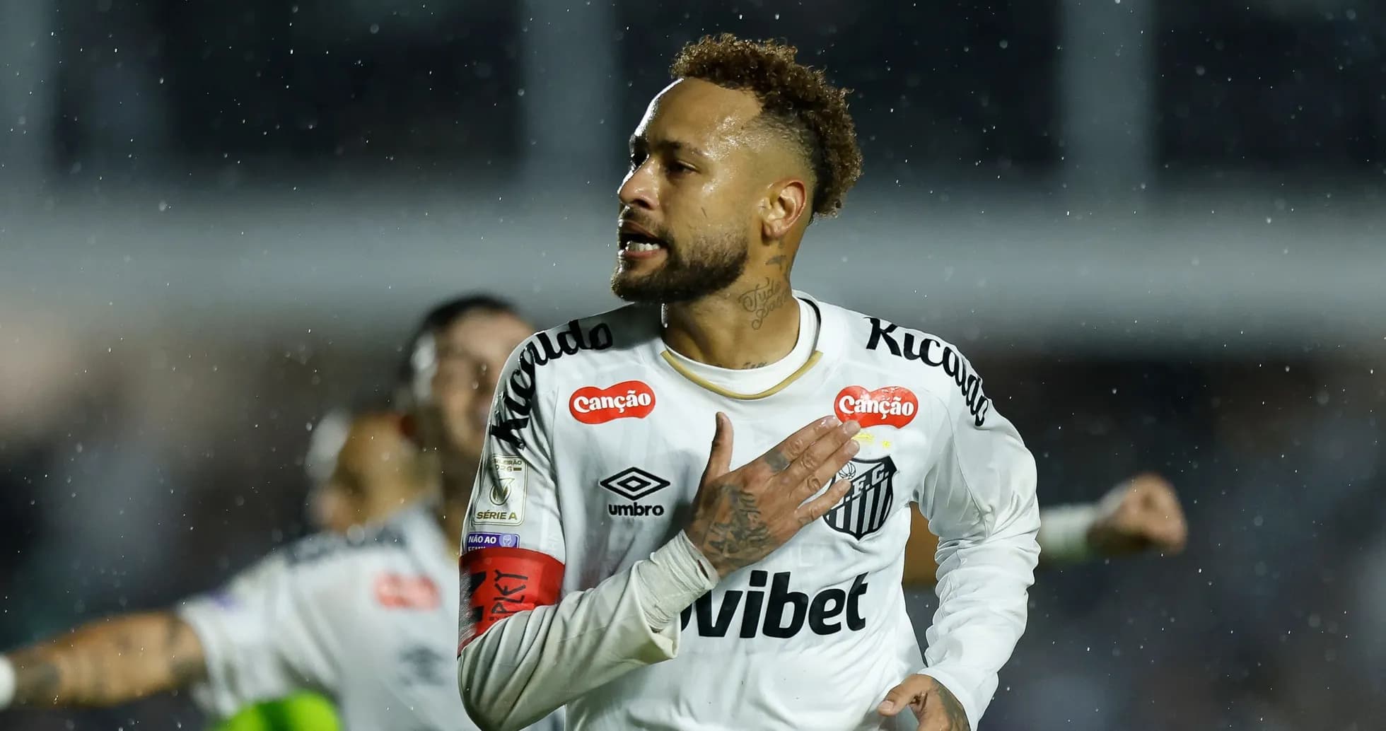 Player celebrating with hand on chest during match