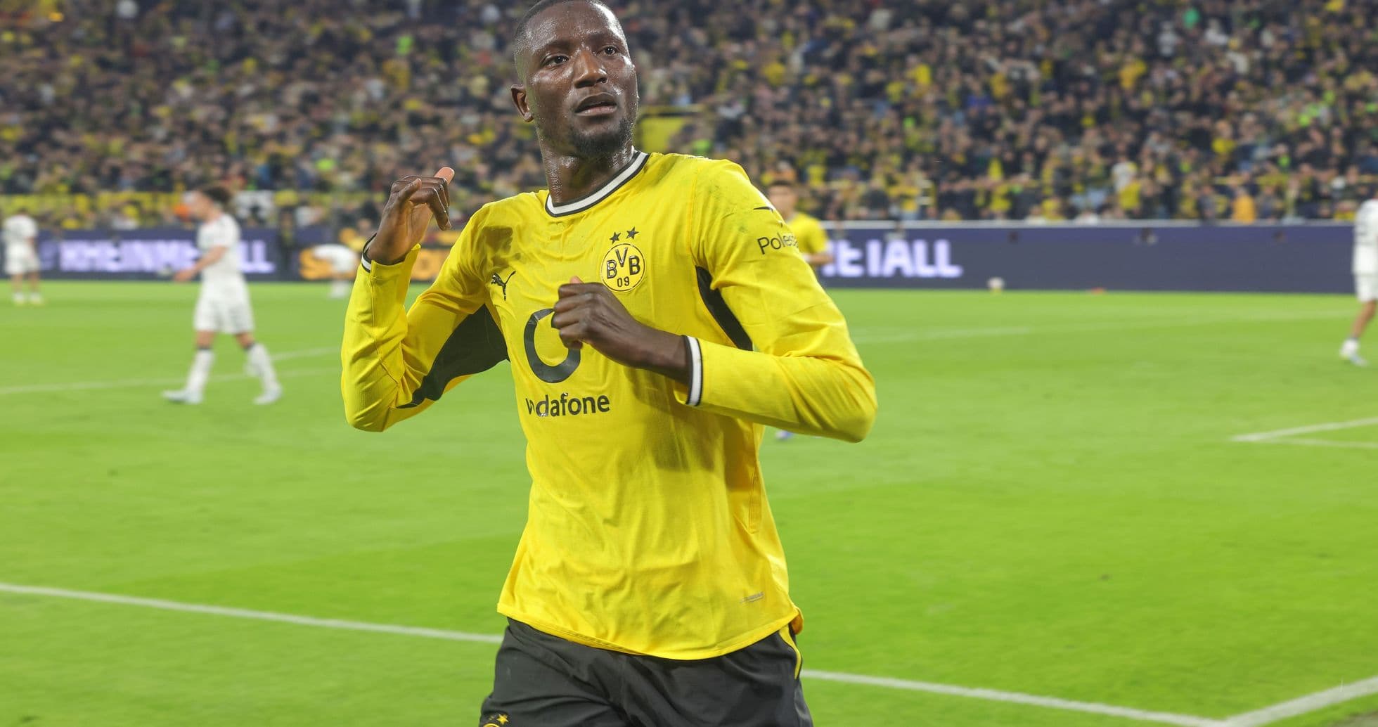 Player celebrating after scoring a goal for Borussia Dortmund