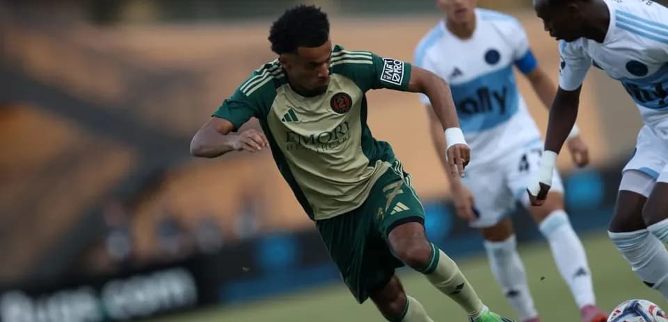 Atlanta United II player dribbling against opponent