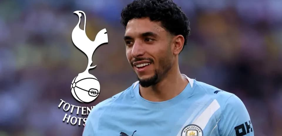 Player in Manchester City jersey with Tottenham logo