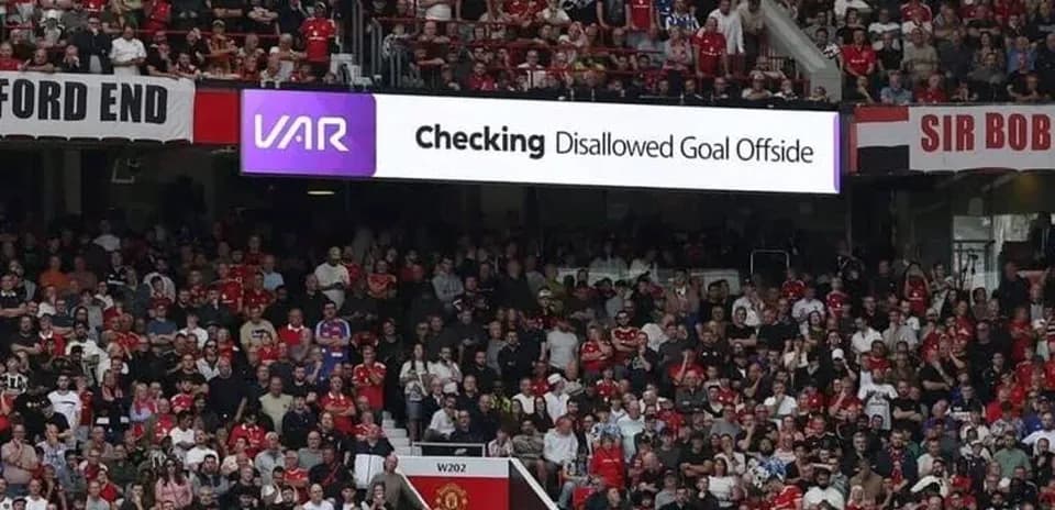 Crowd watching VAR decision on disallowed goal
