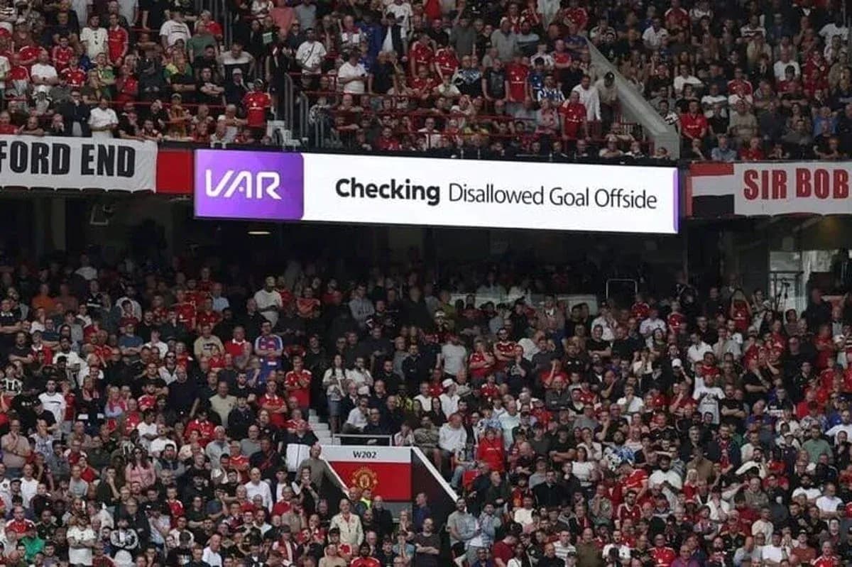 Crowd watching VAR decision on disallowed goal