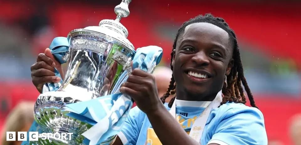 Player celebrating with trophy after winning match