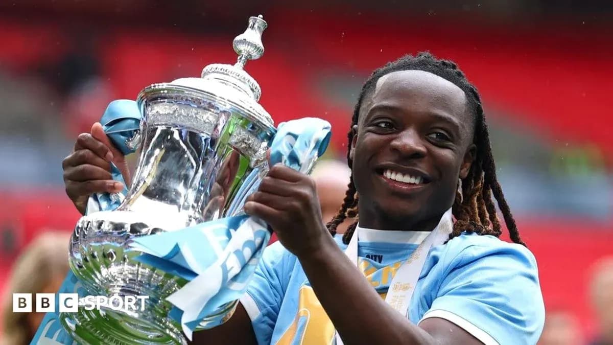 Player celebrating with trophy after winning match