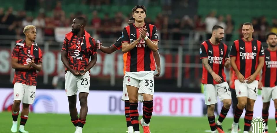 AC Milan players celebrating after match