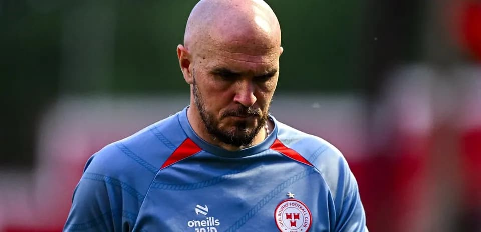 Player walking off training pitch in club jersey