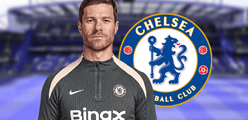 Coach in Chelsea training gear with club logo