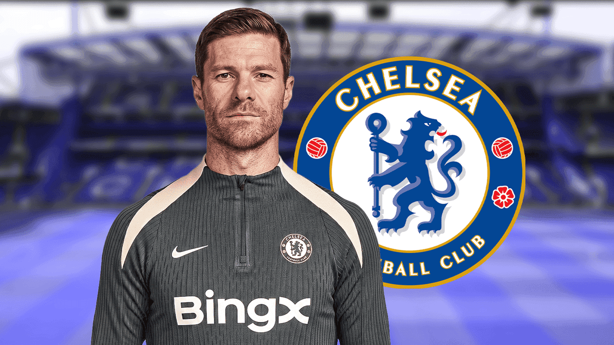 Coach in Chelsea training gear with club logo