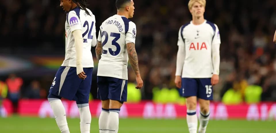 Tottenham players walking on the pitch during match