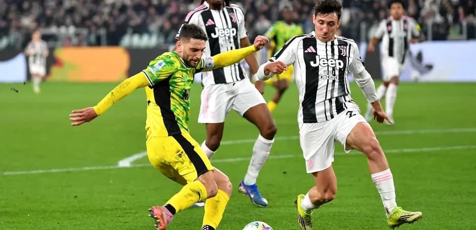 Juventus player tackling opponent during Serie A match