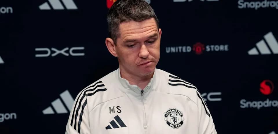 Manchester United manager at press conference table