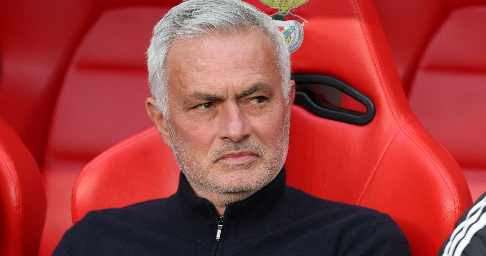 Manager sitting on bench during match